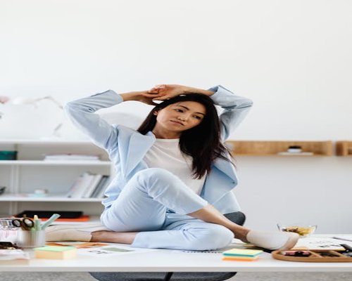 Person doing simple stretches by their office desk